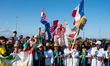 A group of pilgrims with a giant photo of the Pope waits for the beginning of Pope Leo XIV...