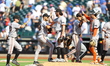 The San Francisco Giants celebrate the team's 12-4 win in the baseball game against the Ne...