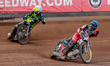 Norick Blodorn of Belle Vue Aces in blue leads Adam Ellis of Ipswich Witches in white duri...
