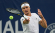 Alexander Zverev of Germany plays a forehand against Alexei Popyrin of Australia during th...