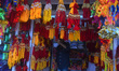 Indian people buy Rakhi, a sacred thread, at a roadside stall ahead of the Hindu festival...