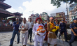 Priests carry the Hindu God Changunarayan as they head towards the gate of Taleju Bhawani...