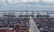 Containers stack at Shanghai Port Container Terminal in Shanghai, China, on August 7, 2025...