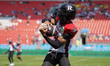 Ottawa RedBlacks defensive back Amari Henderson #4 catches a pass during the warm-up befor...