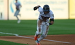 George Lombard Jr. #2 of the Somerset Patriots steals third base and scores on an error du...