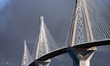 Wildfire smoke rises behind the iconic Rio-Antirrio Bridge near the city of Patras, Greece...