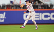 New York Mets third baseman Brett Baty leaps and makes a catch during the fifth inning of...