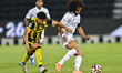Akram Hassan Afif of Al Sadd SC (R) and Said Mohamed Brahmi (L) of Qatar SC are in action...