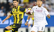 Roberto Firmino of Al Sadd SC (R) and Ali Saoud (L) of Qatar SC are in action during the D...