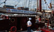 A sailor waits for visitors during Sail in Amsterdam, Netherlands, on August 23, 2025. 