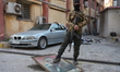 Syrians destroy statues and regime symbols in Damascus, Syria, on December 18, 2024, after...