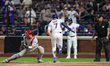 Brett Baty of the New York Mets scores during the eighth inning of a baseball game against...