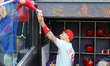 Philadelphia Phillies' Nick Castellanos signs for fans before the baseball game against th...