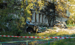 Wrecked cars are seen outside a multi-story residential building in the Dniprovskyi distri...