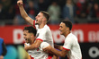 Souffian El Karouani, Dave van den Berg, and Adrian Blake of FC Utrecht celebrate after re...