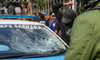 A crowd stages a demonstration in front of the Metro Jaya Regional Police Headquarters in...