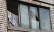 The window panes of a balcony smash due to the shockwave from a Russian drone attack in Dn...