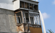 The window panes of a balcony smash due to the shockwave from a Russian drone attack in Dn...