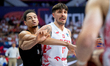 Dominik Olejniczak and Ismael Bako play during the FIBA EuroBasket match between Poland an...