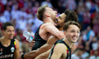 Belgium players Andy Van Vliet and Jean-Marc Mwema celebrate victory in the FIBA EuroBaske...