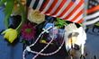 Flowers, photos, and flags are placed on the name panels of the victims of the 9/11 attack...
