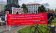 Participants hold a red banner reading ''SYSTEM CHANGE - NOT CLIMATE CHANGE! FUR EINE OKOS...