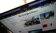 A copy of The New York Times rests on a laptop keyboard in this illustration photo taken o...