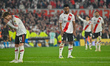 Facundo Colidio and Miguel Borja are visibly dejected after the final whistle during a qua...