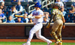 Pete Alonso of the New York Mets hits a sacrifice fly during the seventh inning of a baseb...