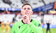 Goalkeeper Dean Henderson of Crystal Palace gestures by putting his finger to his lips as...