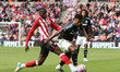 Ollie Watkins of Aston Villa is tackled by Nordi Mukiele of Sunderland during the Premier...