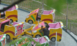 A worker works on the fair wheels, which are being set up for a fair during the upcoming D...