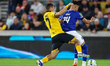 Andre of Wolverhampton Wanderers and Carlos Alcaraz of Everton battle for possession durin...