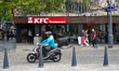 The KFC fast-food restaurant on Rue Georges Clemenceau has people walking and a delivery s...