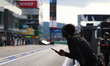 A PROTON COMPETITION team member keeps an eye on the pit activities at the 6 Hours of Fuji...