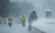 A couple shares a kiss during heavy monsoon rains, while the Mumbai police patrol the Mari...
