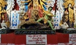 An idol of the Hindu goddess Durga is installed at a community Durga Puja pandal during th...