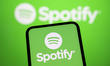 In Creteil, France, on September 29, 2025, the Spotify logo appears on a smartphone with t...
