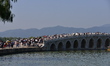 A large number of tourists visit the ancient imperial garden of the Summer Palace in Beiji...