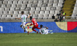 Carel Eiting of Omonoia, Danny Da Costa of Mainz, and Saad Agouzoul of Omonoia compete for...
