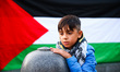 A boy is seen during a protest after Israeli forces intercepted the Global Sumud Flotilla,...