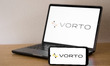 The Vorto AI logo appears on a smartphone screen and on a laptop computer screen in this p...