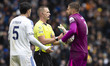 Guglielmo Vicario of Tottenham Hotspur F.C. discusses with Referee Thomas Bramall during t...