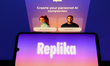 Replika personal AI companion logo is displayed on a mobile phone screen for illustration...