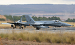 McDonnell Douglas EF-18M Hornet aircraft of the Spain Air Force head towards the runway at...