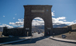 Visitors are seen at the Roosevelt Arch at the north entrance of Yellowstone National Park...