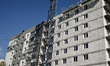 An apartment block at 2A Zaporizka Street, where one section is destroyed and another sect...