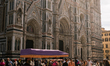 A rickshaw parks in the middle of Piazza del Duomo as tourists walk through the square. In...