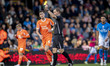 Referee Jacob Miles shows a yellow card to Jordan Brown (6) of Blackpool FC during the Sky...