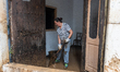 Residents of the town of Godall clean houses and streets after flooding caused by DANA Ali...
